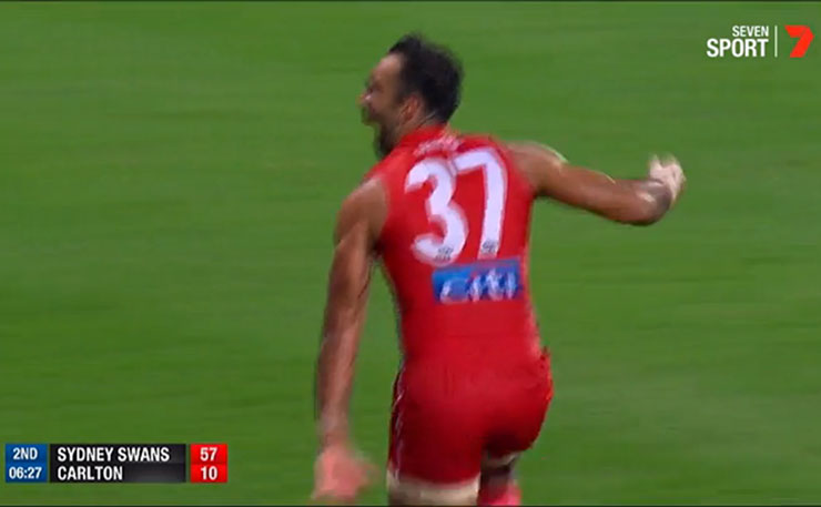 AFL star Adam Goodes celebrates a goal with a war dance at a section of the Carlton crowd who had been booing him every time he received the ball.