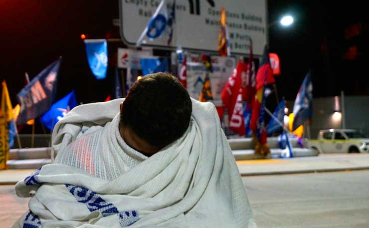 A picket member sleeps overnight in Sydney. Image: Thom Mitchell