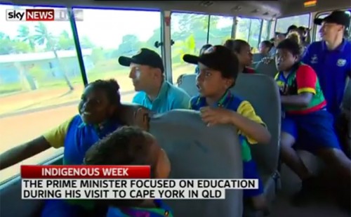 Prime Minister Tony Abbott pictured on a school bus with Cape York school children.