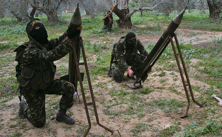 This photo claims to depict masked Palestinian militants from Islamic Jihad with homemade rockets, on the outskirts of Gaza City. (IMAGE: Amir Farshad Ebrahimi, Flickr) 