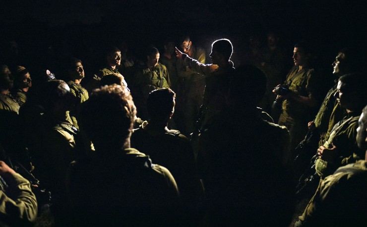 Israeli Defence Force soldiers prepare to enter Gaza during Operation Protective Edge in 2012, an assault which killed more than 2,200 Palestinians - most of them civilians - and 66 Israeli soldiers, plus six Israeli civilians. (IMAGE: IDF, Flickr)