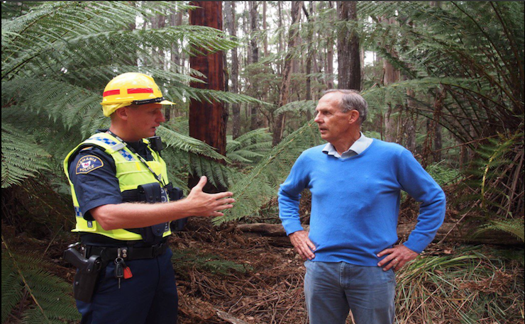 Bob Brown, right, being arrested at a protest in Tasmania.