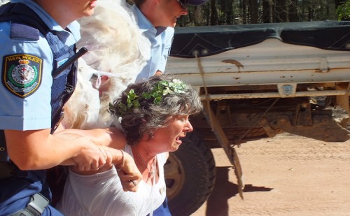 IMAGE: Joanna Evans. Climate Guardian Bronwyn Plarre is removed by Police.