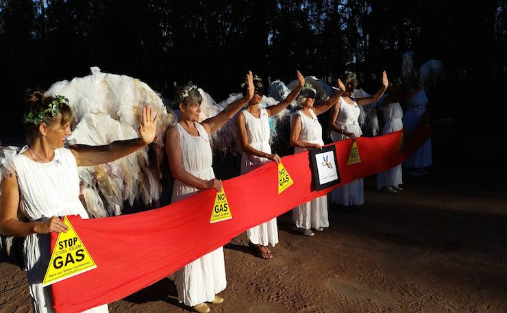IMAGE: Dan Lanzini. 'Climate Angels' block the road to hinder Santos CSG.