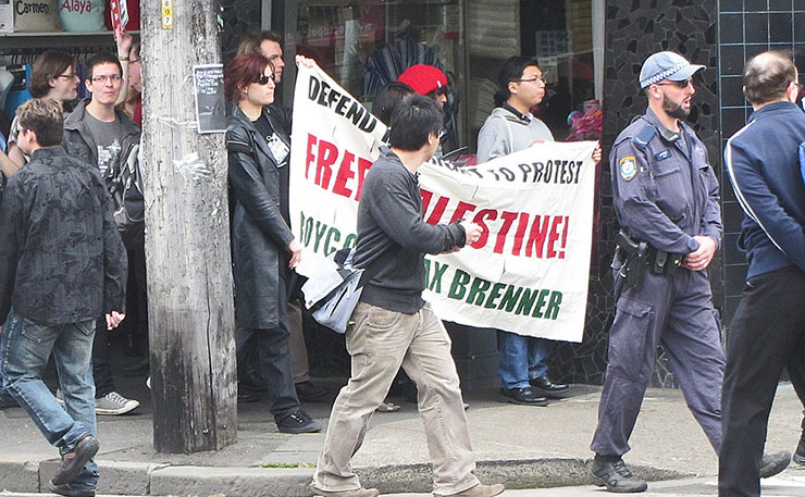 Protestors converge on a Max Brenner chocolate store in Newtown, Sydney in 2011. (IMAGE: Newtown grafitti, Flickr)