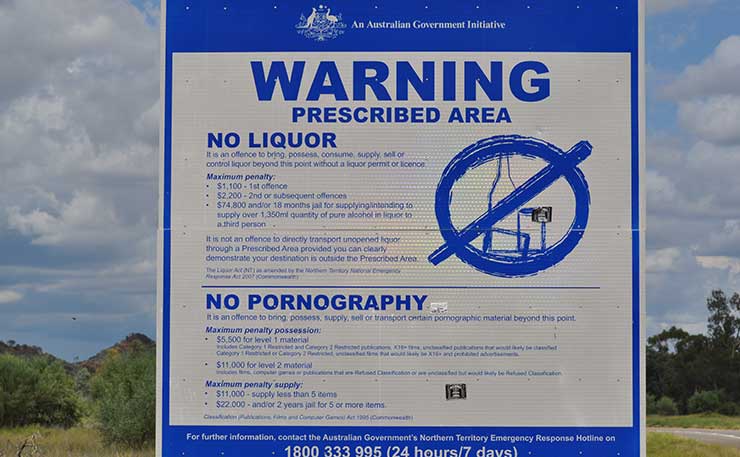 The signs erected in Aboriginal communities in the Northern Territory, which warn residents accessing pornography from government computers is a criminal offence.