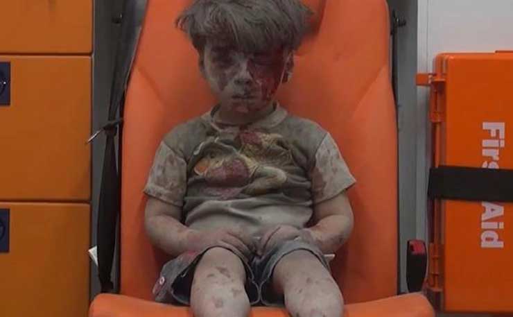 A screenshot from a video showing Omran Daqneesh, after yet another assault in Syria.