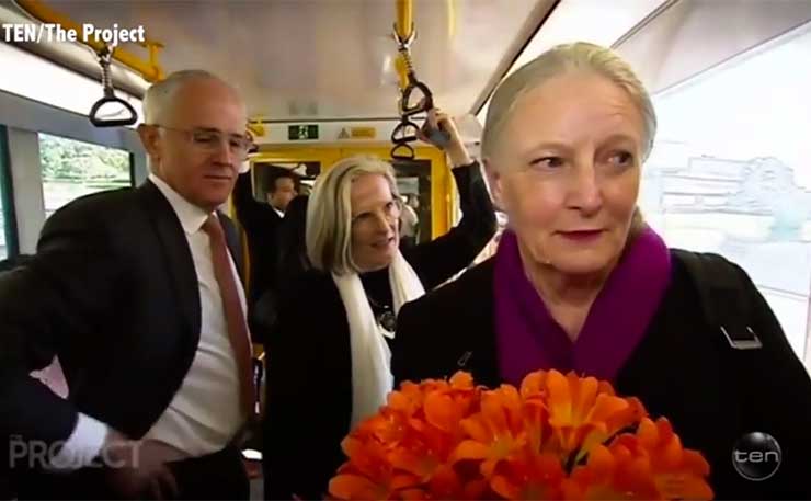 A screencap from Channel 10's The Project, showing an awkward encounter for the Prime Minister on a train to western Sydney.