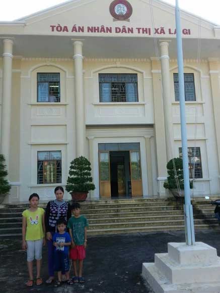 Mrs Lua and her family, pictured in Vietnam recently.