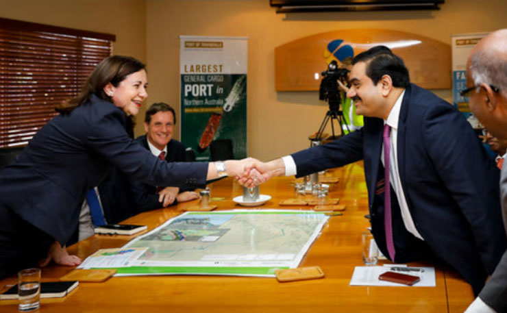 Queensland Premier Annastacia Palaszczuk shakes hands with Gautam Adani, Port of Townsville, 6 December 2016. (IMAGE: AAP)