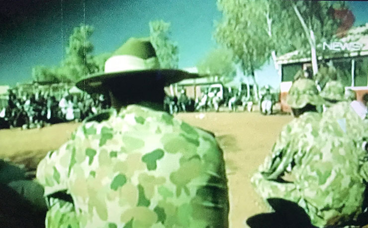 A screencap from John Pilger's film Utopia, showing soldiers at the first meeting of the intervention taskforce in the remote community of Mutitjulu.