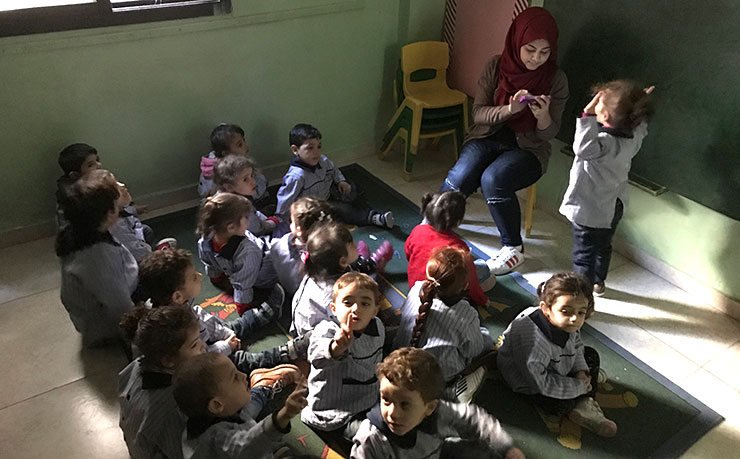 Palestinian and Syrian children in class at the Bourj el-Barajneh refugee camp in Beirut, Lebanon. (IMAGE: Chris Graham, New Matilda)