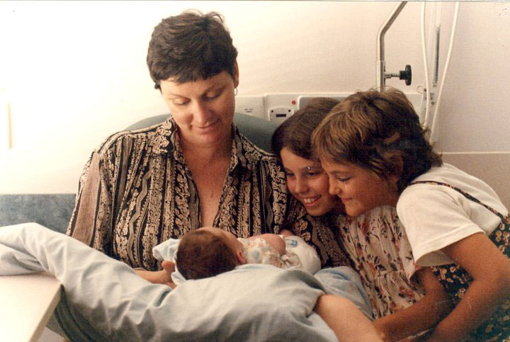 The author and her sister Ellie meeting Jack for the first time as Jane looks on.