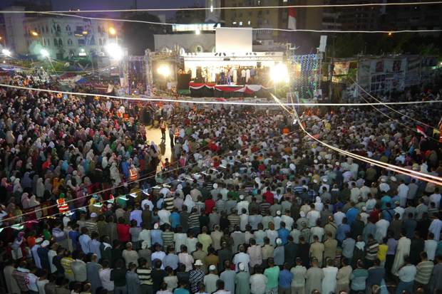 Rabaa Al-Adeweya square, Nasr City, Cairo. Maghrib prayer at the MB camp. Photo by Rachel Williamson.