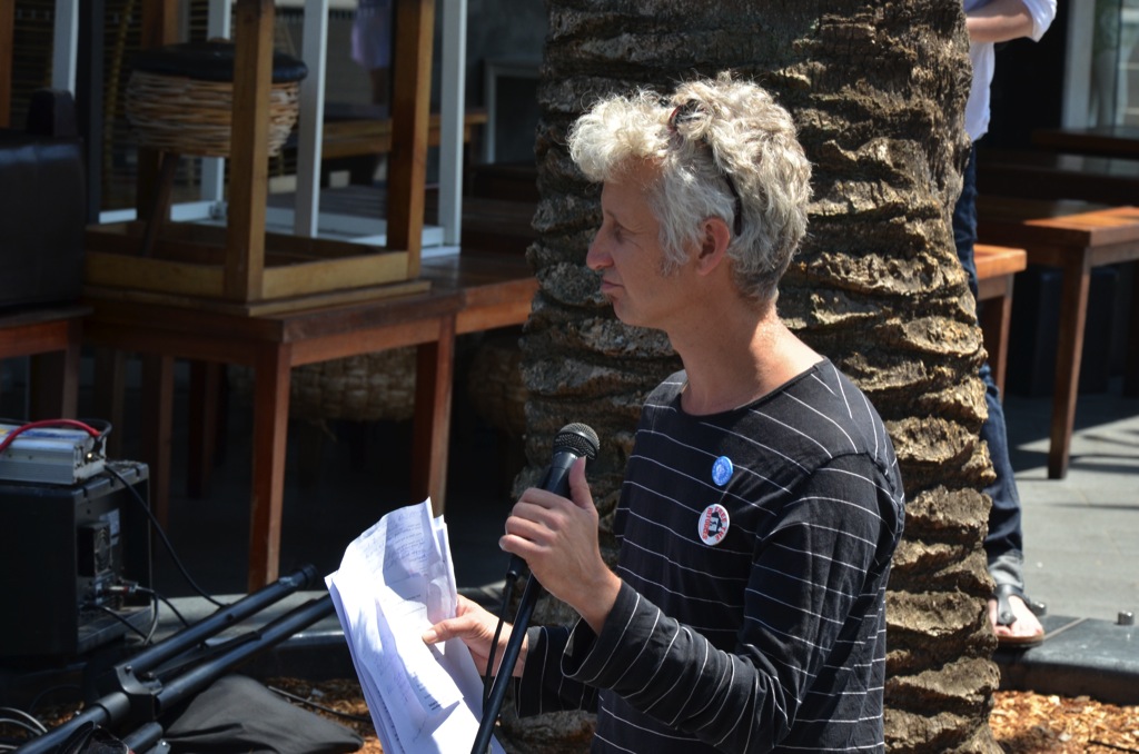 Human rights activist Mark Goudkamp addresses the crowd outside Scott Morrison’s electoral office.