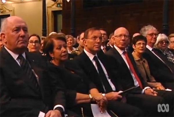 Prime Minister Tony Abbott, pictured during applause at the Gough Whitlam memorial.