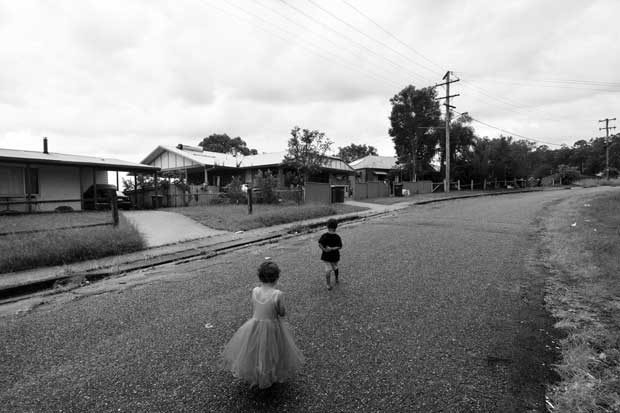 The main street of the Bowraville mission, where three Aboriginal kids went missing over a six month period in 1990 and 1991. The children pictured are relatives of the deceased.