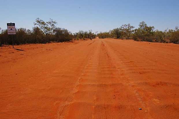 This is the road to Irrultja, between Ampilatwatja and Utopia in Central Australia. The sign in the left of the pic reads: "Roads to recovery: A federal government initiative." The pic is from 2010. The road looked the same in 2014.