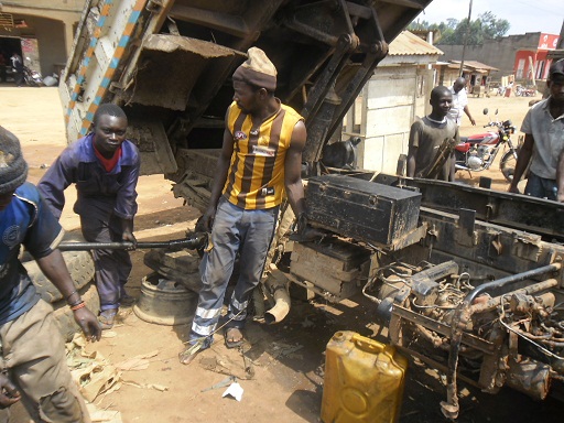 A former child soldier learns auto mechanics. Photo courtesy of Eunice Chin.