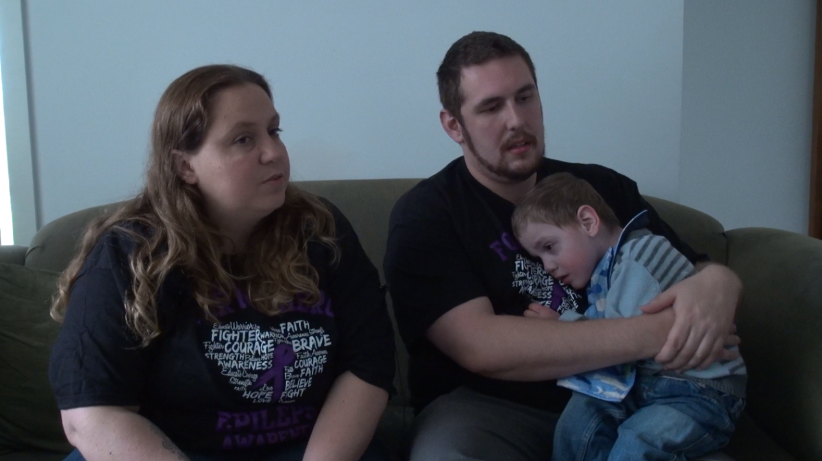 Cassie Batten and Rhett Wallace with their son Cooper. Image: Denham Sadler.