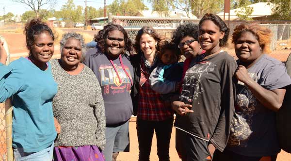 The Muckaty mob at Mulga camp in Alice Springs, receiving the good news that they won their seven-year battle agaqinst plans to build a nuclear waste dump on their land. Pictured third from left is Kylie Sambo, and delivering the news is Beyond Nuclear Initiative campaigner Nat Wasley.