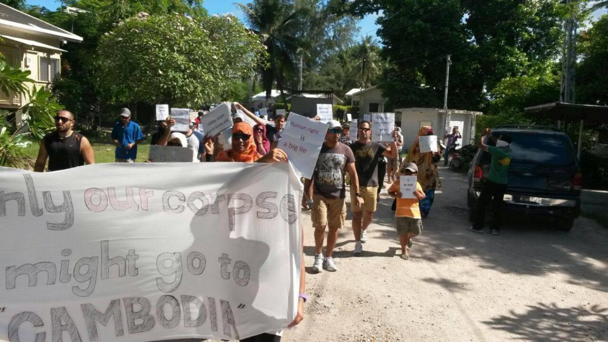 Refugees march in Nauru, Monday