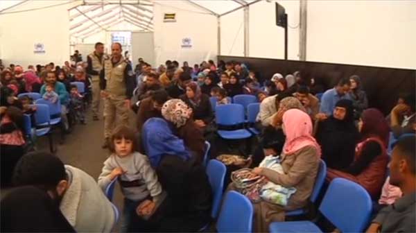 A screen grab from footage of UNHCR workers processing the one millionth Syrian refugee to flee into neighbouring Lebanon earlier this year.