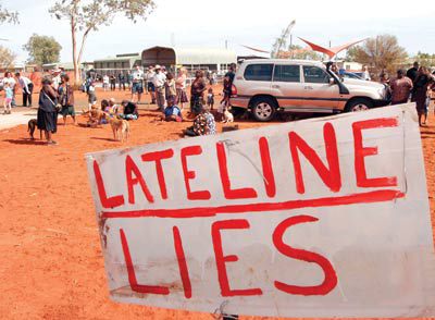 A sign at the community of Mutitjulu in protest against the Lateline coverage, and a visit by Minister Mal Brough.
