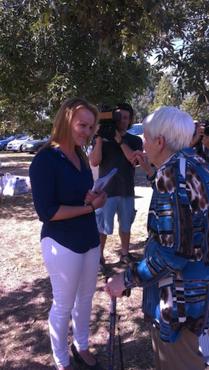Liberal candidate Fiona Scott speaks to a voter at Glenmore Park high school. Photo: Max Chalmers